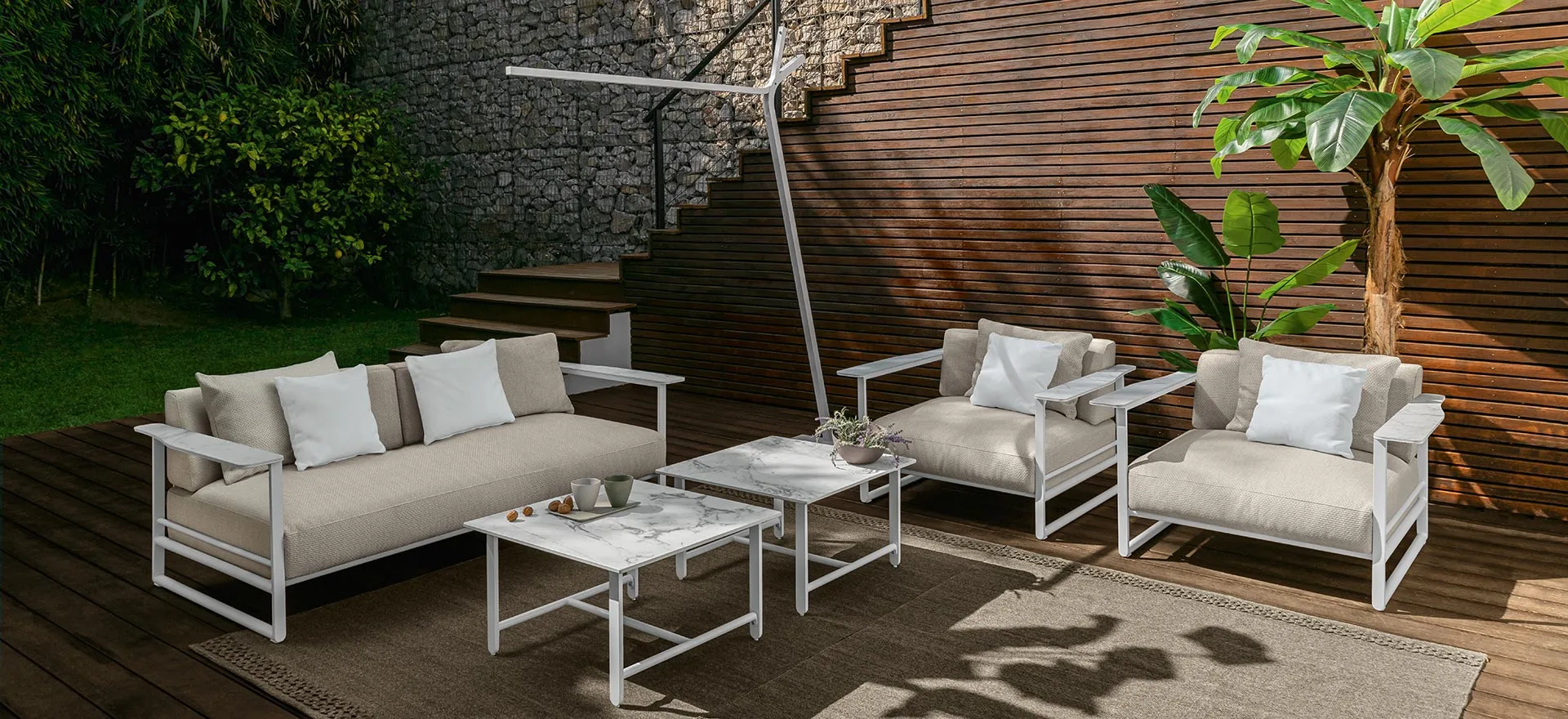 A Talenti Riviera sofa on a deck above the water