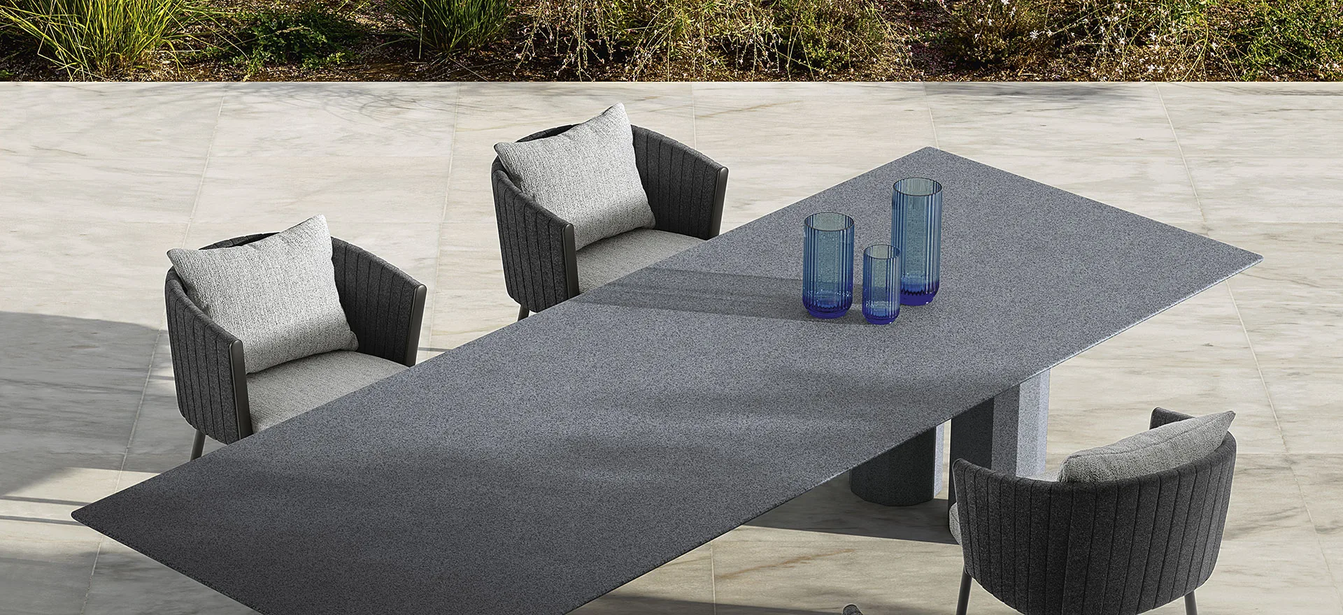 Talenti Salinas outdoor sofa by Ludovica and Roberto Palomba with padded belts, seating near an outdoor kitchen